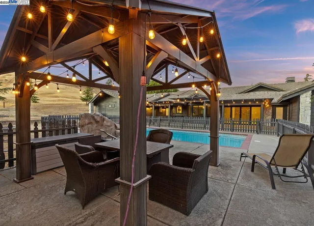 a view of a swimming pool with a patio