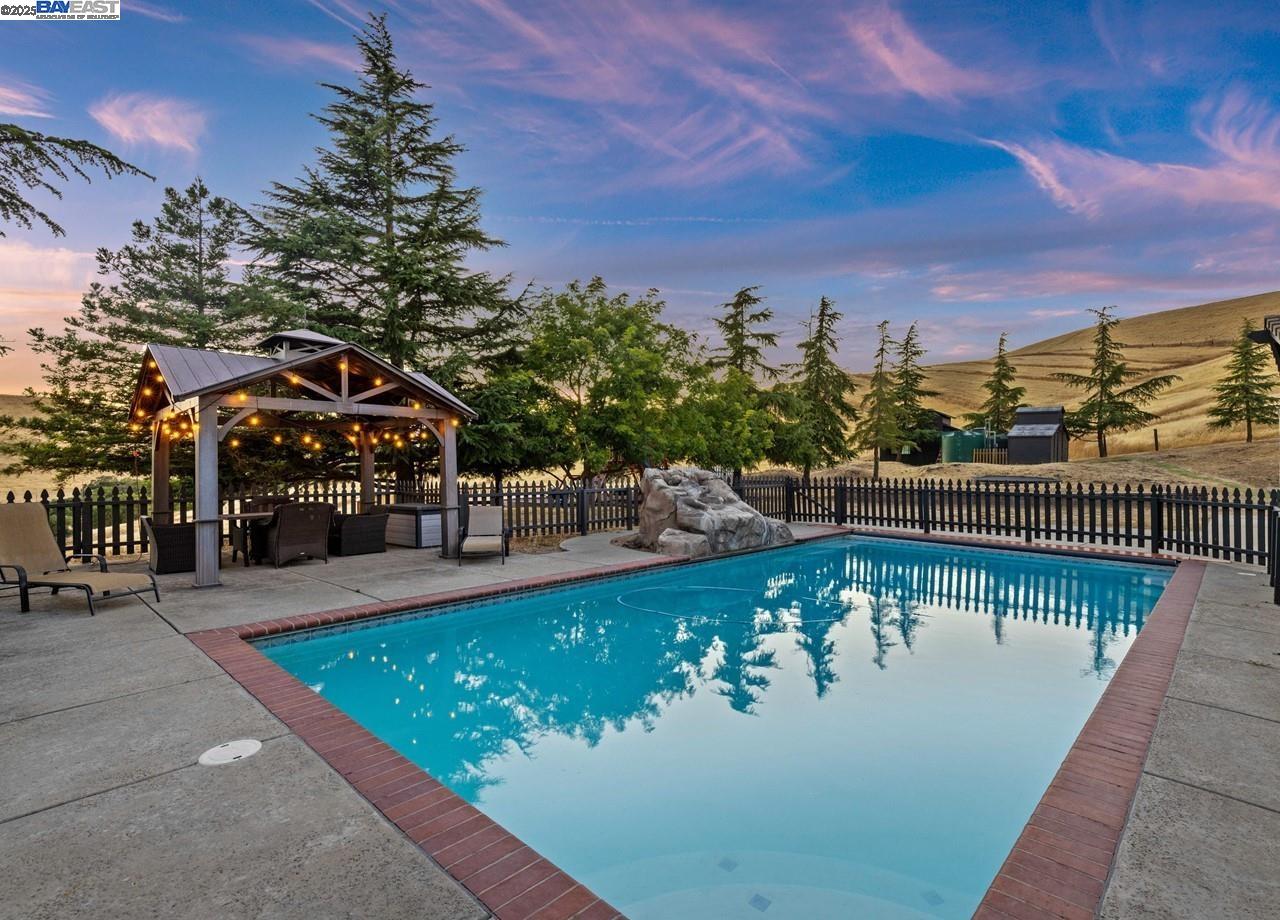 8191 Highland Road Livermore, CA 94551 - Photo 37 of 59 a view of a swimming pool with a patio