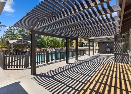 a view of swimming pool with a lounge chair