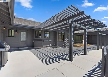 a view of a house with a tree in front