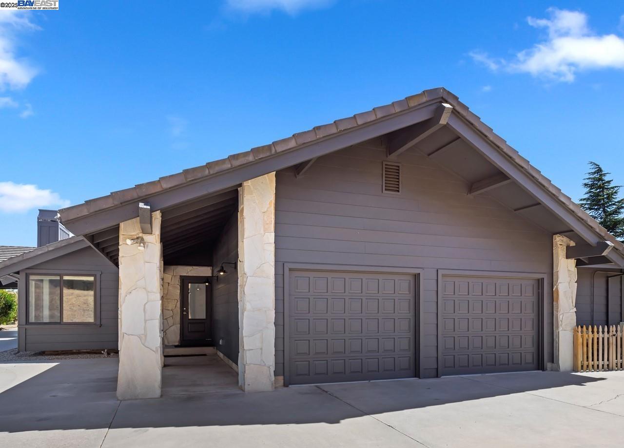 8191 Highland Road Livermore, CA 94551 - Photo 41 of 59 a front view of a house with a garage