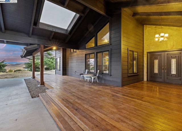 a view of a livingroom with furniture window and wooden floor