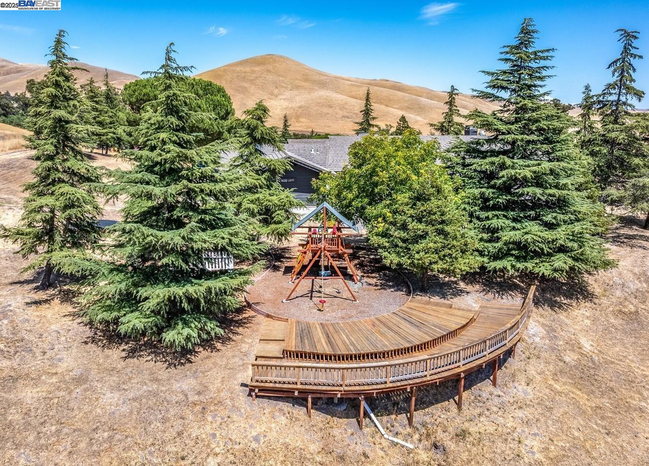8191 Highland Road Livermore, CA 94551 - Photo 56 of 59 a swimming pool with trees in the background