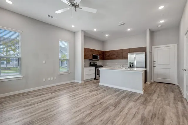 a view of kitchen with wooden floor and window