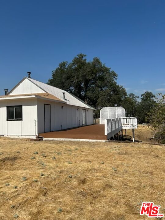 4132 Usona Road Mariposa, CA 95338 - Photo 21 of 26 a big white house with a big yard and large trees