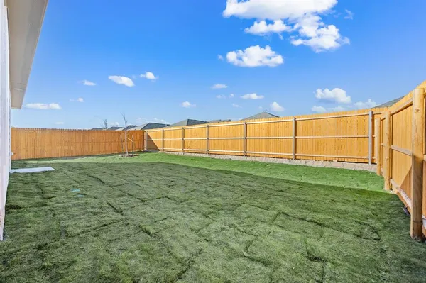 a view of a big room with wooden fence