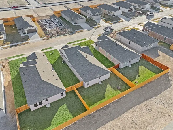 an aerial view of a house with a garden