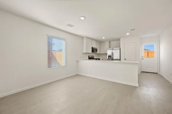 a view of kitchen with furniture and window