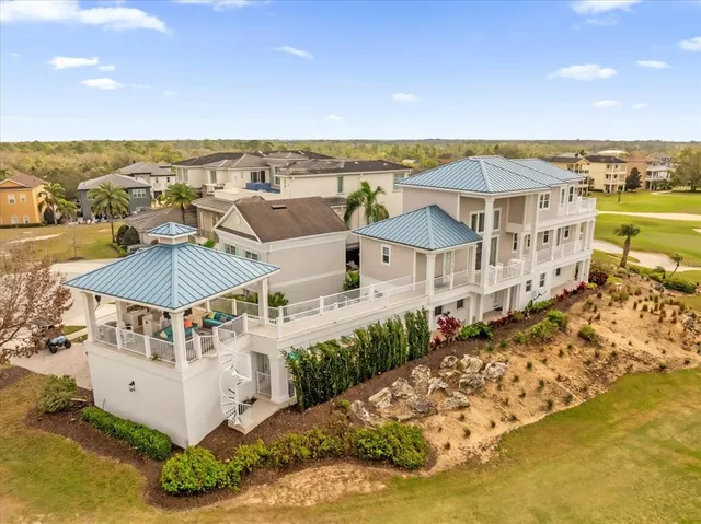 an aerial view of a house with a lake view