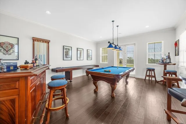 a living room with dining table and chairs