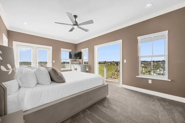 a bedroom with a large bed and a window