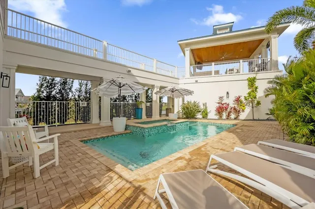 a view of a porch with a table and chairs