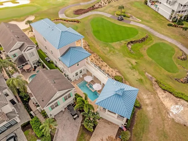 an aerial view of a house with a swimming pool