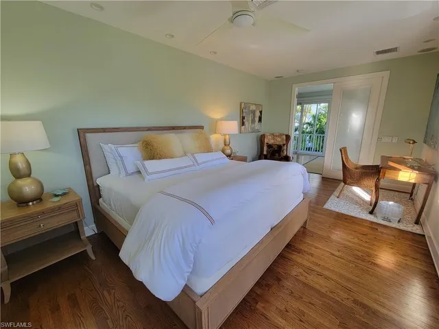 a bedroom with bed and window