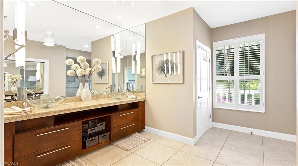 877 7th Street South Naples, FL 34102 - Photo 15 of 45 Full bath featuring double vanity, light tile patterned floors, and recessed lighting