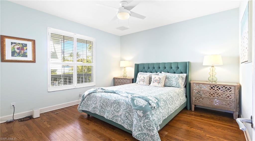 877 7th Street South Naples, FL 34102 - Photo 22 of 45 Bedroom with dark wood-style flooring and ceiling fan