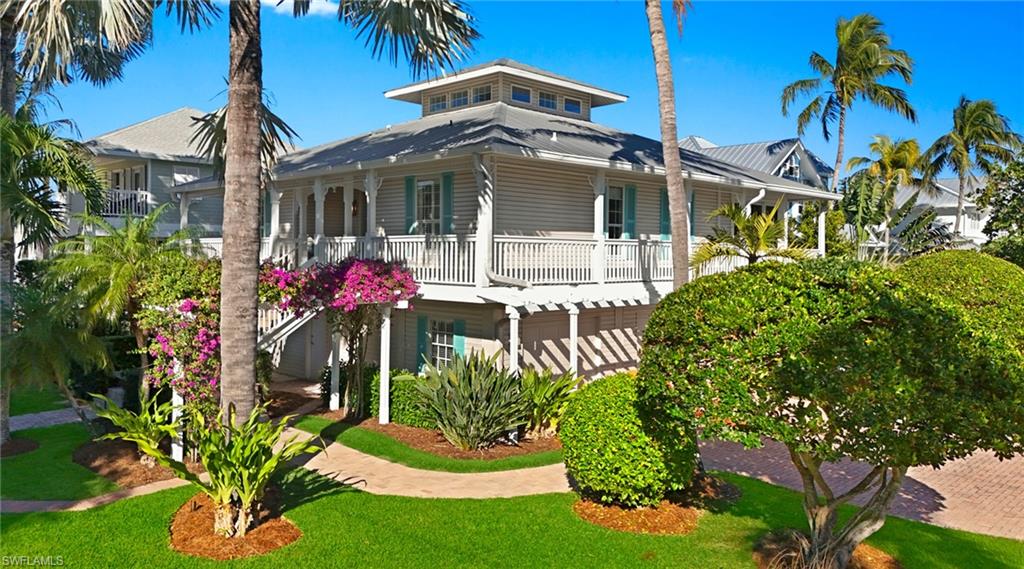 877 7th Street South Naples, FL 34102 - Photo 3 of 45 View of front facade with a porch