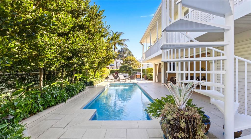 877 7th Street South Naples, FL 34102 - Photo 36 of 45 Outdoor pool featuring a patio and a balcony