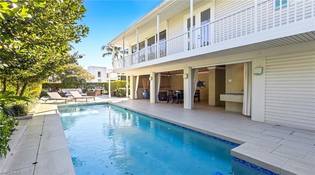 877 7th Street South Naples, FL 34102 - Photo 37 of 45 View of pool with patio surround and a balcony