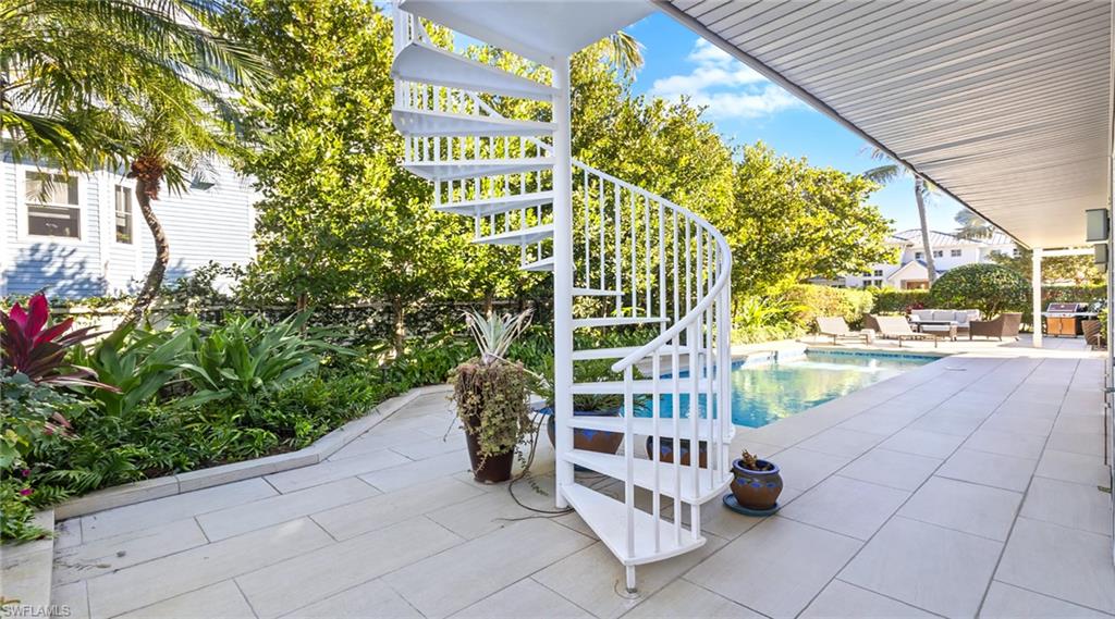 877 7th Street South Naples, FL 34102 - Photo 40 of 45 Outdoor pool featuring a patio area and outdoor seating