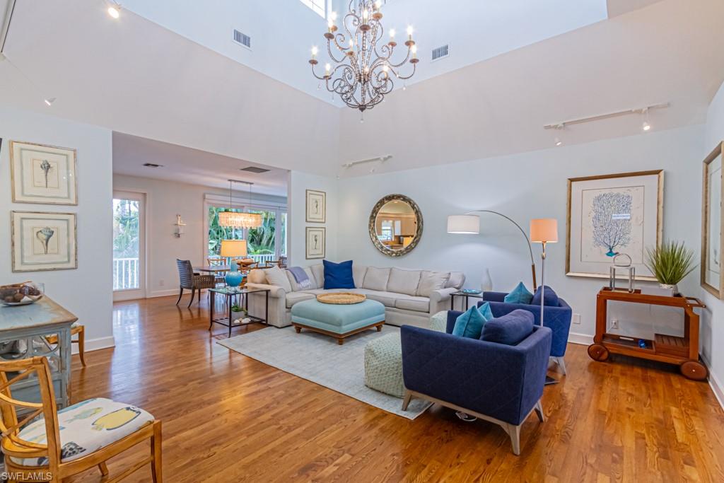 877 7th Street South Naples, FL 34102 - Photo 5 of 25 a living room with furniture and a large window