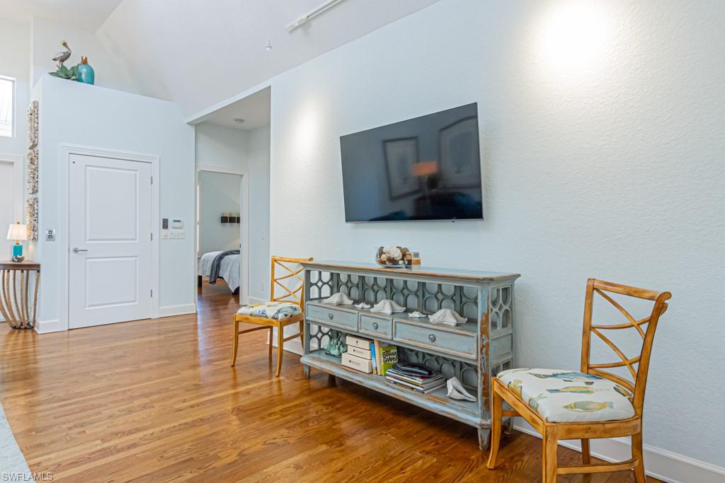 877 7th Street South Naples, FL 34102 - Photo 7 of 25 a living room with furniture and a flat screen tv
