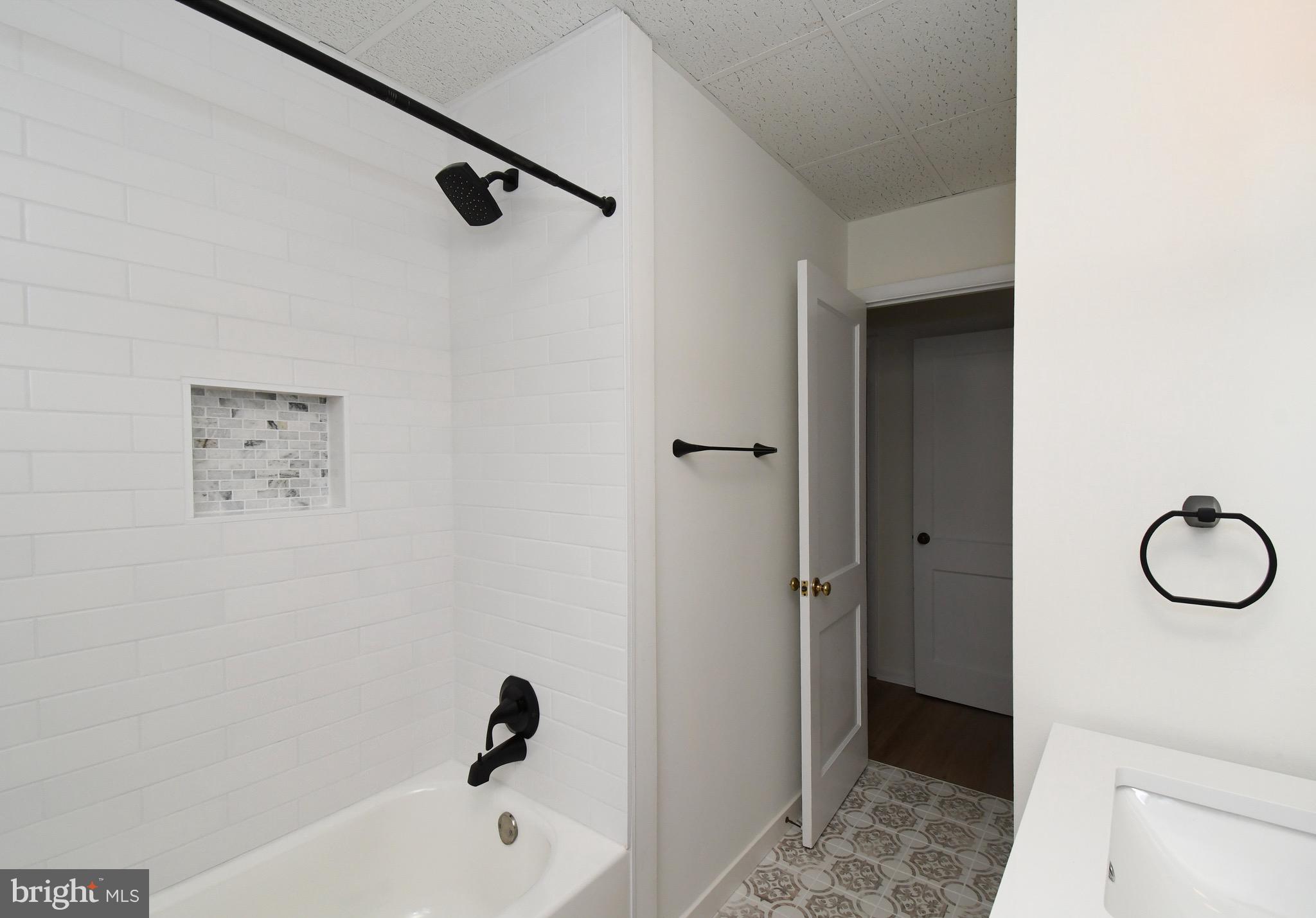 4776 Old Easton Road, Unit 2 Doylestown, PA 18902 - Photo 11 of 25 a bathroom with a tub and a shower