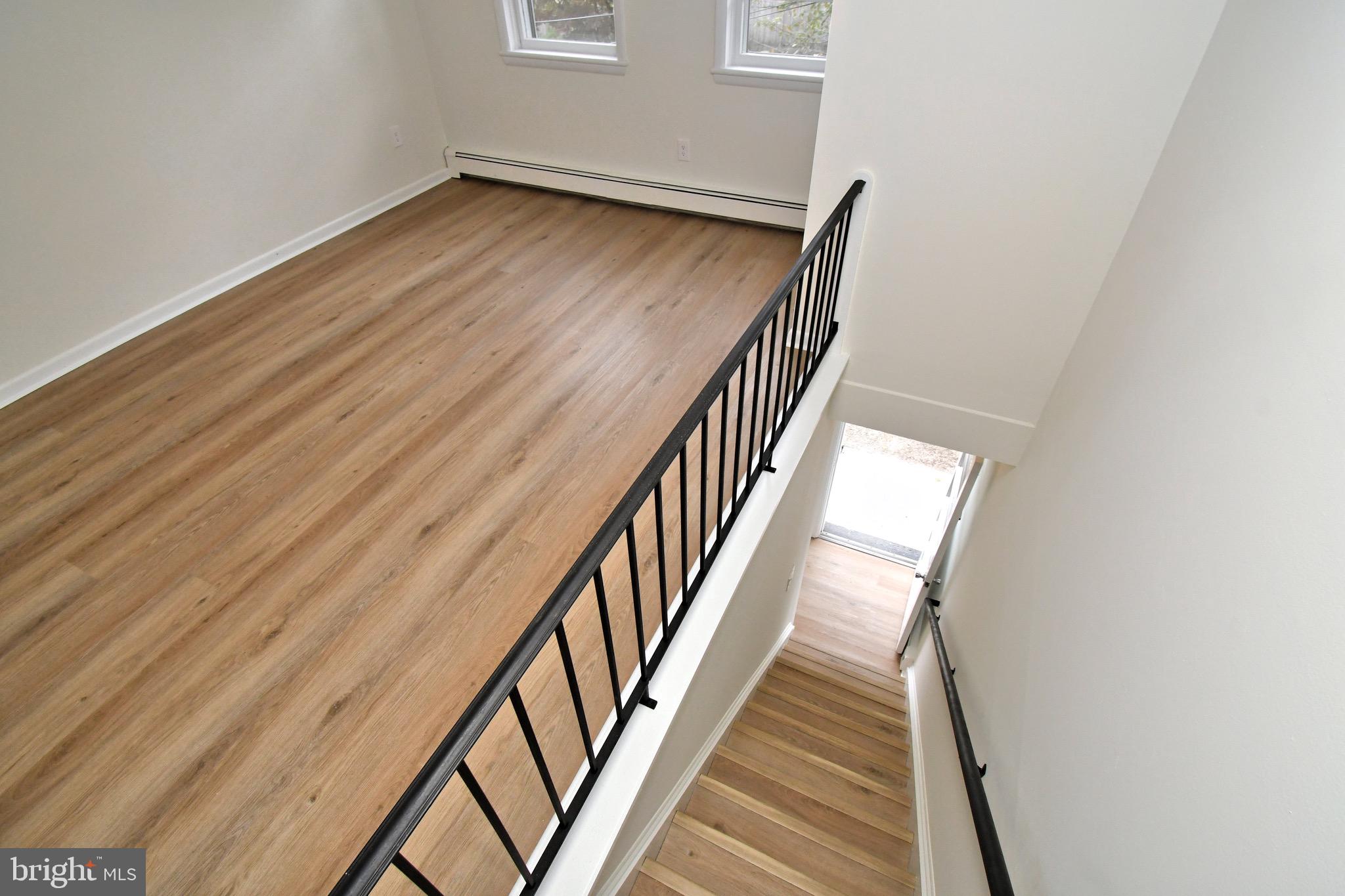 4776 Old Easton Road, Unit 2 Doylestown, PA 18902 - Photo 14 of 25 a view of wooden floor in an empty room
