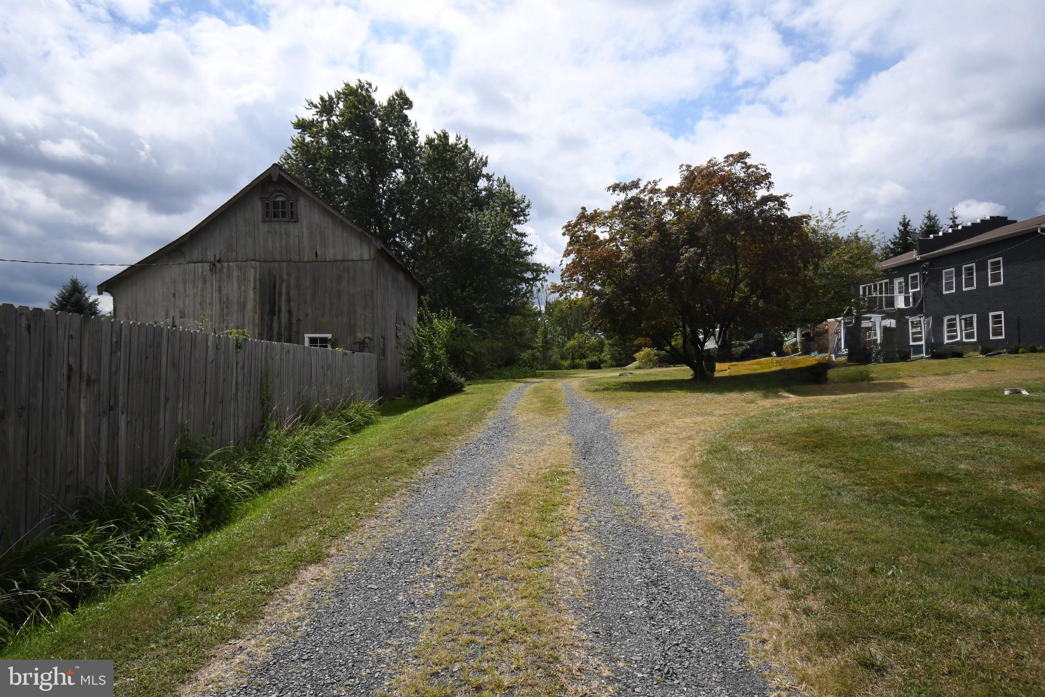 4776 Old Easton Road, Unit 2 Doylestown, PA 18902 - Photo 25 of 25 a view of yard with swimming pool and green space