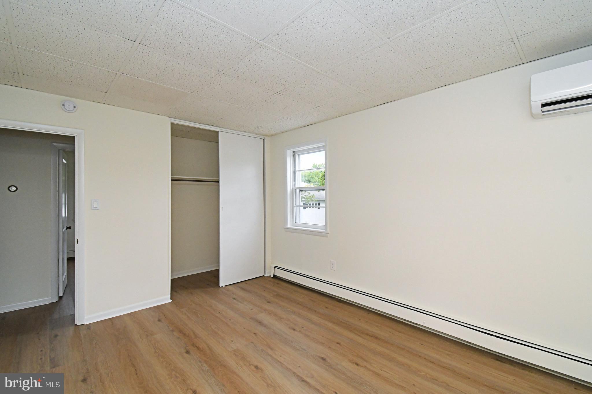 4776 Old Easton Road, Unit 2 Doylestown, PA 18902 - Photo 9 of 25 a view of an empty room with wooden floor