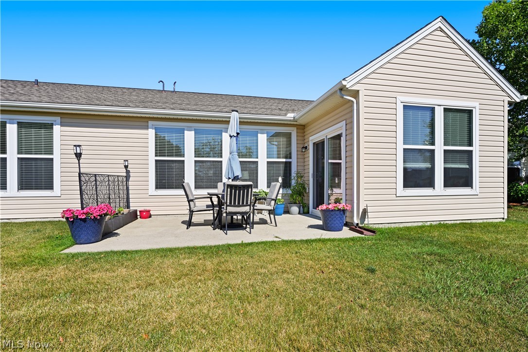 9188 Prairie Moon North Ridgeville, OH 44039 - Photo 37 of 40 Back of property featuring a yard and a patio