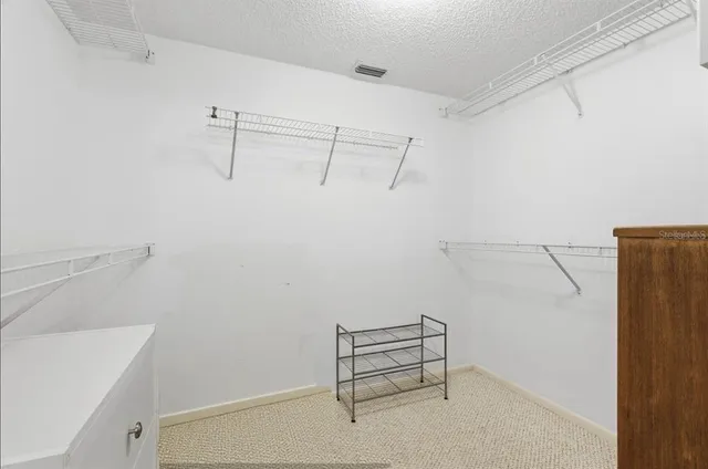 a view of a room with racks on the wall