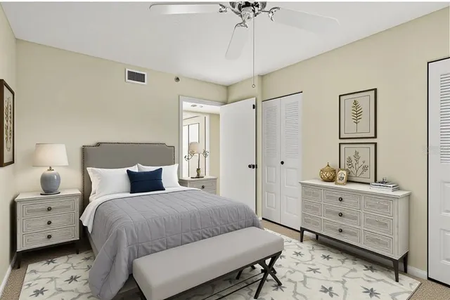 a bedroom with a bed and a dresser