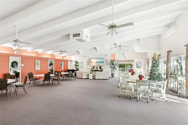 a living room with lots of furniture and a chandelier