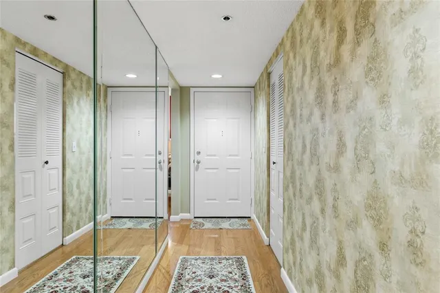a bathroom with a glass shower door