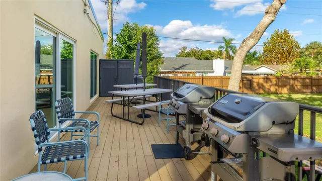 a view of a balcony with chairs and a table