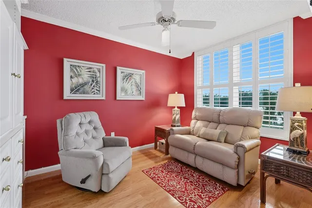 a living room with furniture a table and a window