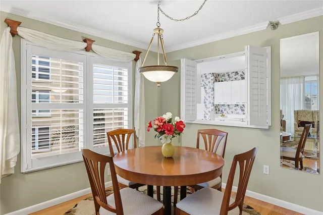 a view of a dining room with furniture window and outside view