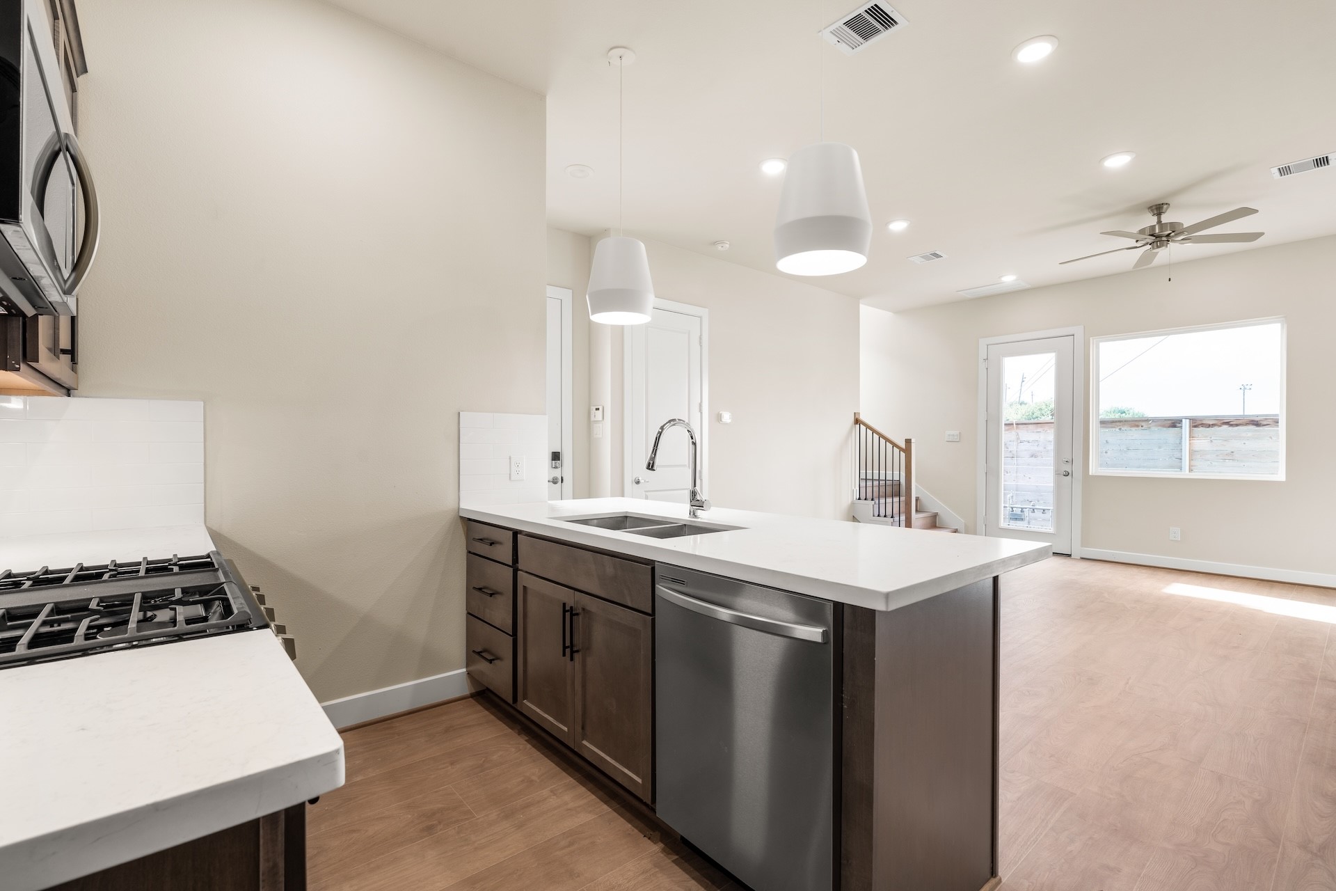 6521 Rena Street Houston, TX 77092 - Photo 6 of 24 Open-concept kitchen perspective — seamless sightlines from the prep island to the main living hall, stainless dishwasher, and soft modern color palette.