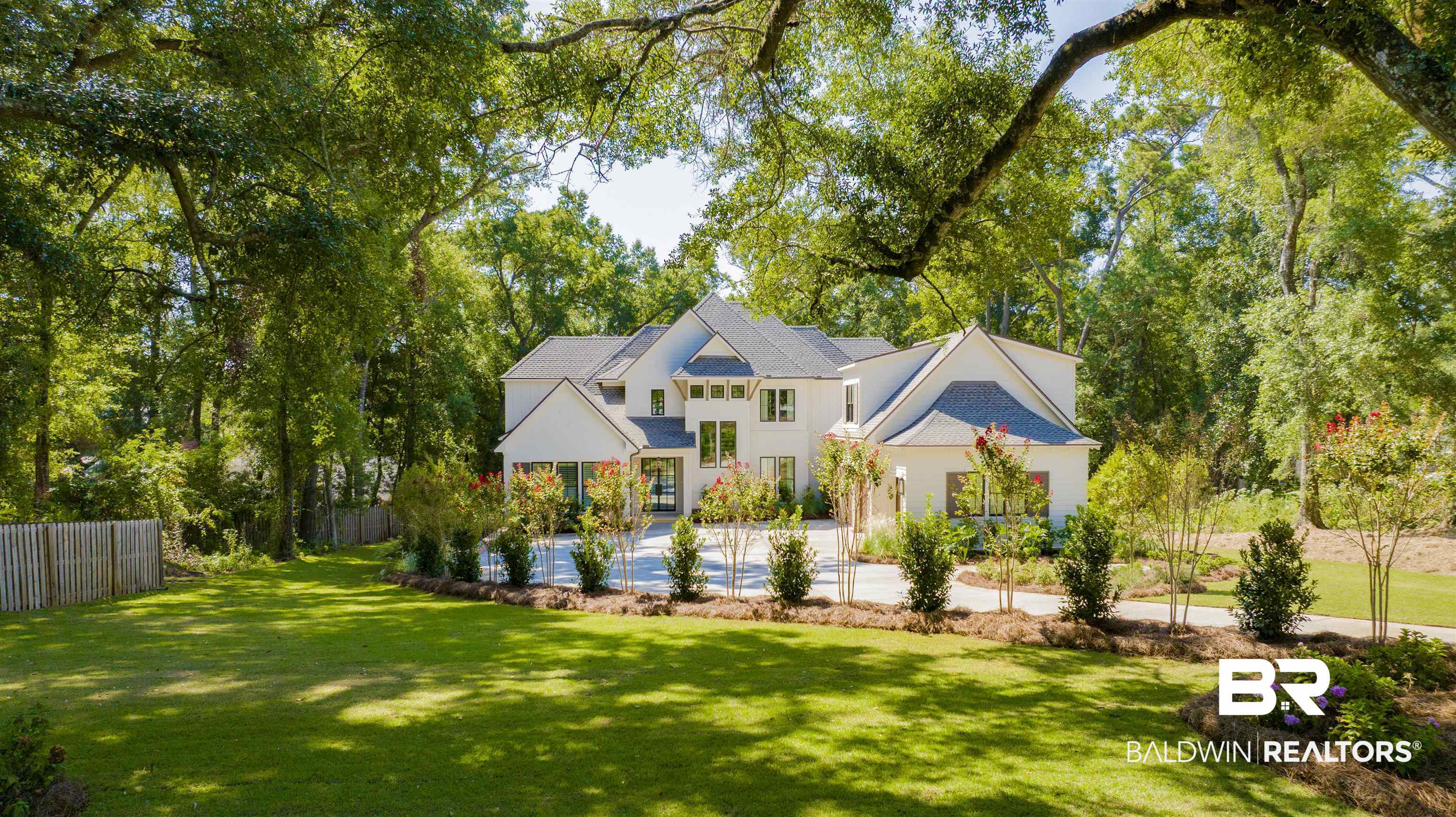 7248 Parker Road Fairhope, AL 36532 - Photo 5 of 55 View of front of property with view of scattered trees and stucco siding