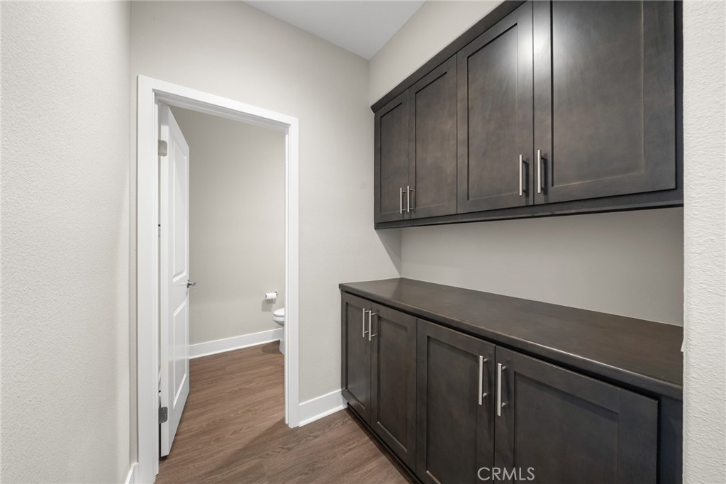 25110 Cherry Ridge Drive Canyon Country, CA 91387 - Photo 13 of 74 a view of a storage and utility room with wooden floor