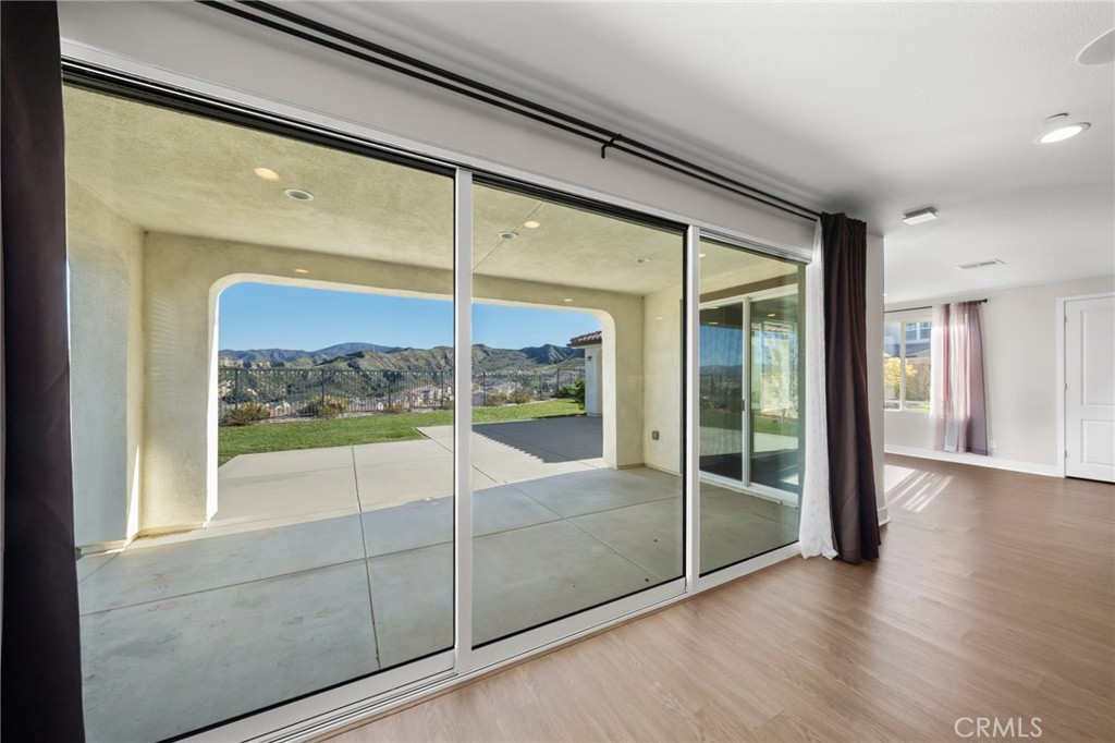25110 Cherry Ridge Drive Canyon Country, CA 91387 - Photo 18 of 74 a view of a room with wooden floor and a large window