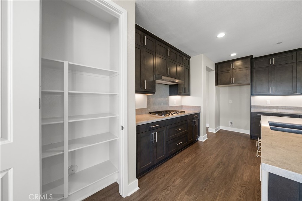 25110 Cherry Ridge Drive Canyon Country, CA 91387 - Photo 28 of 74 a kitchen with a refrigerator and a stove top oven
