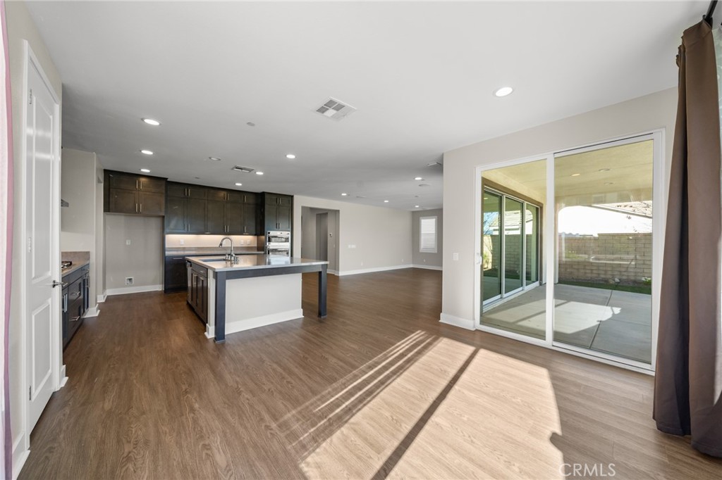 25110 Cherry Ridge Drive Canyon Country, CA 91387 - Photo 31 of 74 a large kitchen with kitchen island a sink stainless steel appliances and cabinets