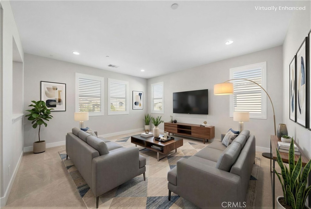 25110 Cherry Ridge Drive Canyon Country, CA 91387 - Photo 37 of 74 a living room with furniture and a flat screen tv
