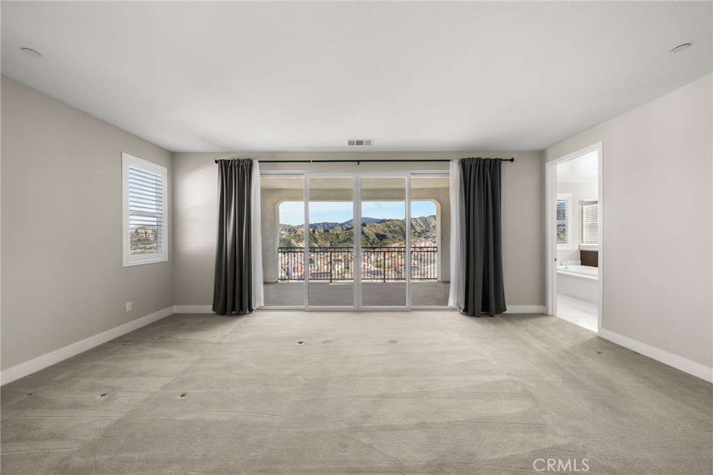 25110 Cherry Ridge Drive Canyon Country, CA 91387 - Photo 41 of 74 an empty room with windows and closet