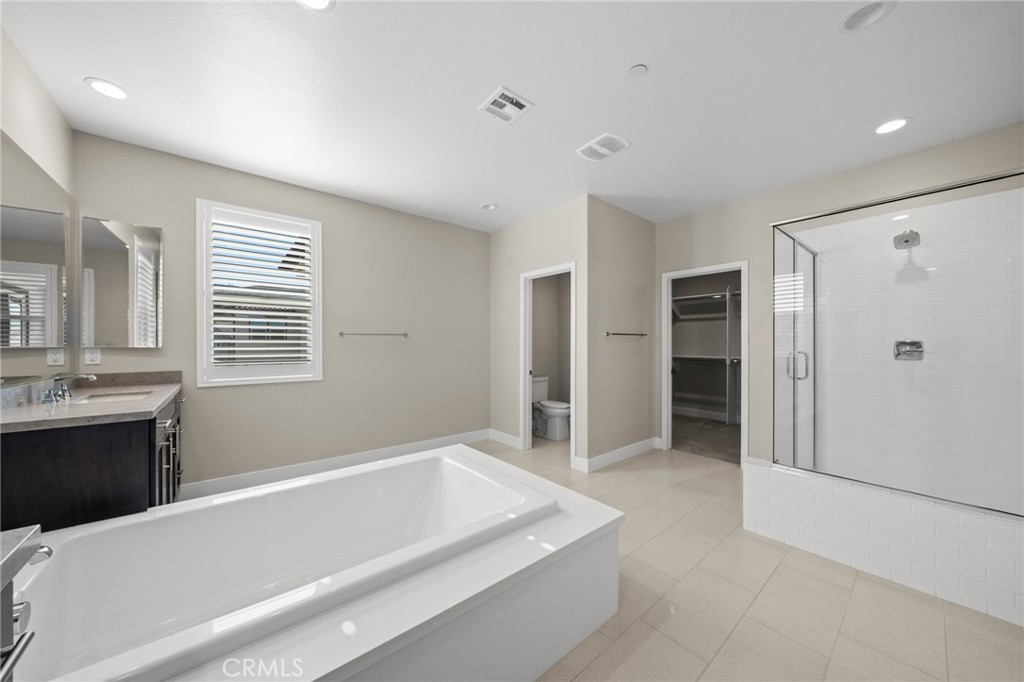 25110 Cherry Ridge Drive Canyon Country, CA 91387 - Photo 52 of 74 a spacious bathroom with a bathtub and a shower