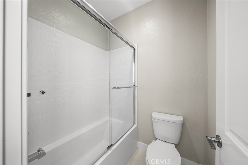25110 Cherry Ridge Drive Canyon Country, CA 91387 - Photo 60 of 74 a bathroom with a toilet and a shower