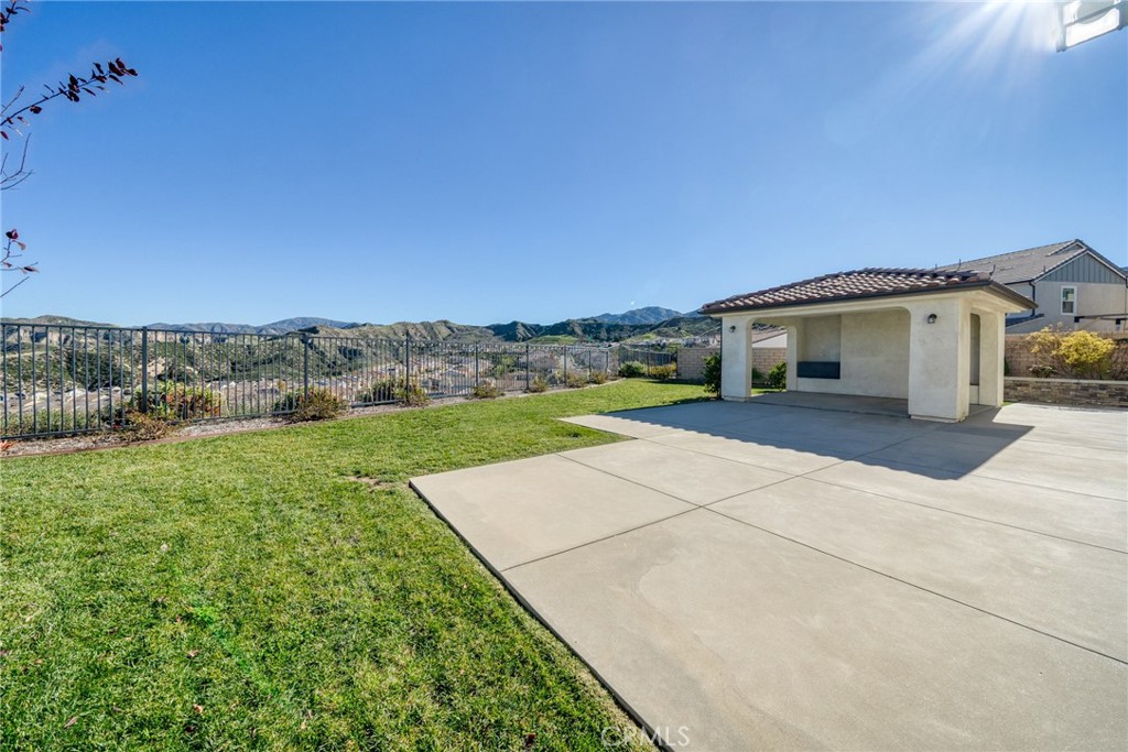 25110 Cherry Ridge Drive Canyon Country, CA 91387 - Photo 68 of 74 a view of a house with a yard