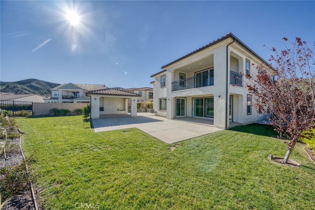 25110 Cherry Ridge Drive Canyon Country, CA 91387 - Photo 69 of 74 a front view of house with yard and trees in the background